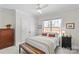 Bright bedroom with queen bed, natural light, and closet at 1241 Rollins Ave, Charlotte, NC 28205