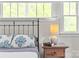 The bed in the bedroom has soft bedding and a decorative headboard at 1241 Rollins Ave, Charlotte, NC 28205