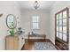 Elegant foyer featuring hardwood floors, classic bench, and stylish decor, creating a welcoming first impression at 1241 Rollins Ave, Charlotte, NC 28205