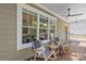 Cozy rocking chairs on the porch with stylish decor creating a relaxing outdoor living space with scenic views at 1241 Rollins Ave, Charlotte, NC 28205