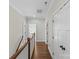 Hallway with wood floors, white trim, and natural light at 1241 Rollins Ave, Charlotte, NC 28205
