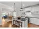 Modern kitchen with island seating, stainless appliances, and open concept layout at 1241 Rollins Ave, Charlotte, NC 28205