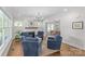 Bright living room with fireplace, hardwood floors, and comfortable seating arrangement creating a welcoming atmosphere at 1241 Rollins Ave, Charlotte, NC 28205