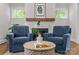 Inviting living room highlighting fireplace and decor, with a smooth transition to the dining room and kitchen at 1241 Rollins Ave, Charlotte, NC 28205
