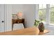 Bright home office with a large window, contemporary desk, and view of the trees at 1241 Rollins Ave, Charlotte, NC 28205