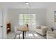 Bright home office with a large window, contemporary desk, and modern decor at 1241 Rollins Ave, Charlotte, NC 28205