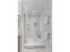 A new white shower is fitted with glass doors and stainless steel fixtures at 1241 Rollins Ave, Charlotte, NC 28205