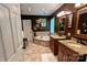 This bathroom features double sinks, granite countertops, a bathtub, and dark colored walls at 12610 Angel Oak Dr, Huntersville, NC 28078