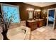 This bathroom features double sinks, granite countertops, tile floor, and a jacuzzi style tub at 12610 Angel Oak Dr, Huntersville, NC 28078