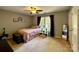 This bedroom has a window view, wood flooring, and neutral paint at 12610 Angel Oak Dr, Huntersville, NC 28078