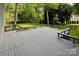 Enjoy this home's spacious gray deck overlooking the property's fenced in backyard and lush green landscape at 12610 Angel Oak Dr, Huntersville, NC 28078