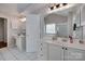 Bright bathroom featuring dual vanities, white tile floors, and a separate shower and tub at 12719 Vantage Point Ln, Huntersville, NC 28078
