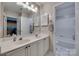 Bathroom with a double sink vanity and access to the shower and toilet at 12719 Vantage Point Ln, Huntersville, NC 28078