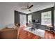 Comfortable bedroom featuring hardwood floors and multiple windows at 12719 Vantage Point Ln, Huntersville, NC 28078