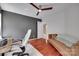 Comfortable bedroom featuring hardwood floors and multiple windows at 12719 Vantage Point Ln, Huntersville, NC 28078