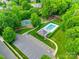 Aerial view showcasing a community pool, tennis courts, and playground at 12719 Vantage Point Ln, Huntersville, NC 28078