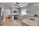 Updated kitchen with granite countertops, stainless steel appliances, and modern lighting, perfect for cooking at 12719 Vantage Point Ln, Huntersville, NC 28078