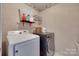 Well-organized laundry room with modern washer and dryer units at 12719 Vantage Point Ln, Huntersville, NC 28078