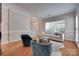 Open-concept living room with natural light, showcasing the staircase, fireplace, and hardwood floors at 12719 Vantage Point Ln, Huntersville, NC 28078