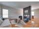 Stylish living room featuring a modern fireplace, hardwood floors, and neutral decor for a cozy ambiance at 12719 Vantage Point Ln, Huntersville, NC 28078