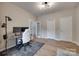 Bright office space with wood floors, dual monitors on desk and two points of entry from the hallway and french doors at 12719 Vantage Point Ln, Huntersville, NC 28078
