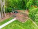 Community playground with slides and swings offers a fun and safe play area for children at 12719 Vantage Point Ln, Huntersville, NC 28078