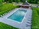 Community pool with lounge chairs and adjacent gazebo, perfect for relaxation and recreation at 12719 Vantage Point Ln, Huntersville, NC 28078