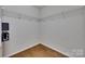 Spacious walk-in closet with custom shelving provides ample storage space at 12719 Vantage Point Ln, Huntersville, NC 28078