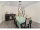 Dining room featuring hardwood floors, elegant furnishings, and modern lighting at 131 Swink Sw St, Concord, NC 28027