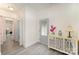 Inviting entryway featuring light gray vinyl floors, a decorative cabinet, and access to other rooms in the home at 131 Swink Sw St, Concord, NC 28027