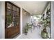 Inviting front porch featuring a glass door, seating area, and natural light at 131 Swink Sw St, Concord, NC 28027