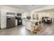 Modern kitchen with granite countertops, stainless steel appliances, and an island with seating at 131 Swink Sw St, Concord, NC 28027