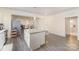 Bright kitchen featuring granite countertops, a center island, and an open layout to dining area at 131 Swink Sw St, Concord, NC 28027