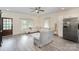 Comfortable living room featuring hardwood floors, neutral tones, and ample natural light at 131 Swink Sw St, Concord, NC 28027