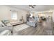 Spacious living room with hardwood floors and an open floor plan to the kitchen at 131 Swink Sw St, Concord, NC 28027