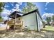 The backyard features a back porch, steps, white painted brick, and a black metal fence at 141 Ole Eastpointe Dr, York, SC 29745