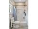 A bathroom featuring a toilet and shower with white vinyl shower surround and a patterned curtain at 141 Ole Eastpointe Dr, York, SC 29745