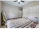 Bright bedroom with a ceiling fan, closet and a neutral color scheme creating a serene retreat at 141 Ole Eastpointe Dr, York, SC 29745
