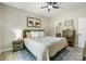 Relaxing bedroom features a comfortable bed, rustic-style furniture, and a soothing color scheme at 141 Ole Eastpointe Dr, York, SC 29745