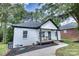 Charming white brick home with a cozy front porch, nestled on a well-maintained lot at 141 Ole Eastpointe Dr, York, SC 29745