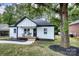 Charming white brick home with a cozy front porch and a beautiful shade tree at 141 Ole Eastpointe Dr, York, SC 29745