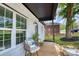 Cozy front porch with chairs and a table, overlooking the well-maintained yard at 141 Ole Eastpointe Dr, York, SC 29745