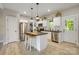 Well-lit kitchen boasts a central island, stainless steel appliances, and ample counter space at 141 Ole Eastpointe Dr, York, SC 29745