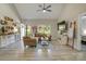 Bright open-concept living room featuring neutral tones, vaulted ceiling, and access to other areas of the home at 141 Ole Eastpointe Dr, York, SC 29745