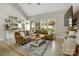 Bright living room with vaulted ceilings, a large window, and stylish decor at 141 Ole Eastpointe Dr, York, SC 29745