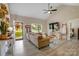 Inviting living room with light wood floors, modern decor, vaulted ceiling, and ample natural light at 141 Ole Eastpointe Dr, York, SC 29745