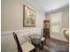 Dining area with a glass-top table, decorative cabinet, and natural light at 142 Highland Dr, New London, NC 28127