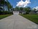 Low angle exterior shot of a single-story home with a concrete driveway at 142 Highland Dr, New London, NC 28127