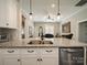 Spacious kitchen island with stainless steel appliances, granite countertops, and open layout flowing into the living area at 142 Highland Dr, New London, NC 28127