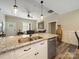Open kitchen with a granite island, stainless steel dishwasher, and seamless flow to the living area, ideal for modern living at 142 Highland Dr, New London, NC 28127